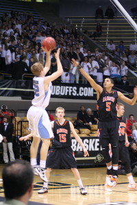 Valor Christian's Chase Foster shoots over Lewis-Palmer's Jordan Scott Saturday night in the 4A finals at the Coors Events Center. 
