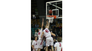 Fairview's Austin Sparks and Miles MacKenzie try to block an unidentified Legend players shot in the first half of their Elite 8 game at the Denver Coliseum Friday.